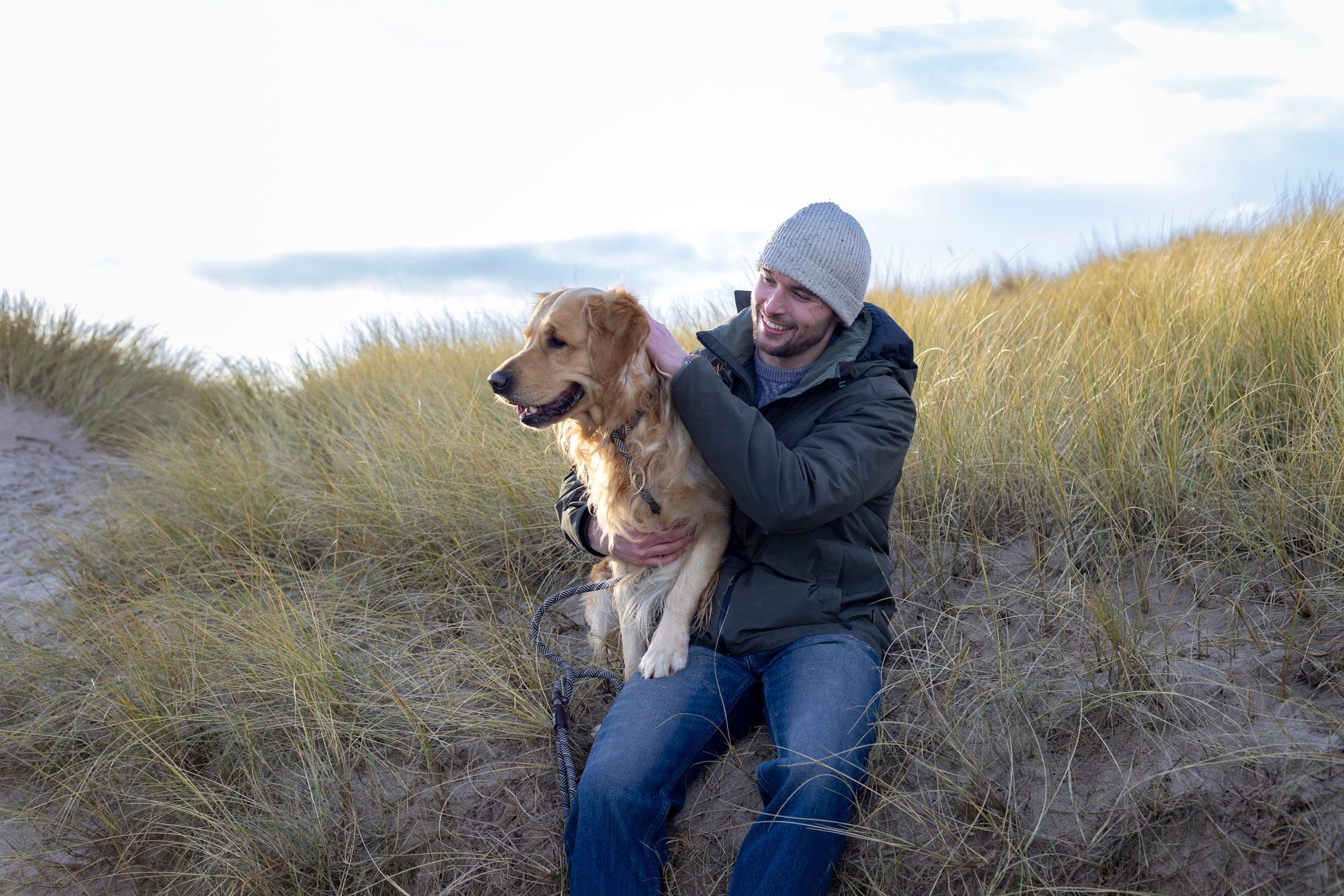 Man with his dog during a walk outdoors